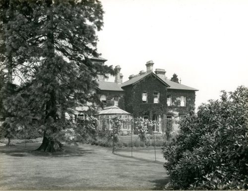 Black and white photo of the old house located in Oaklands Park.