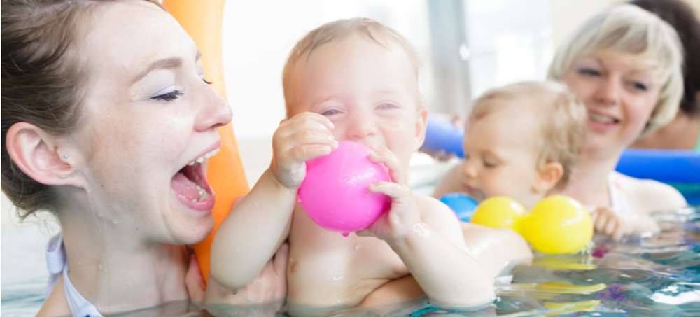 Mothers and babies having fun in the pool