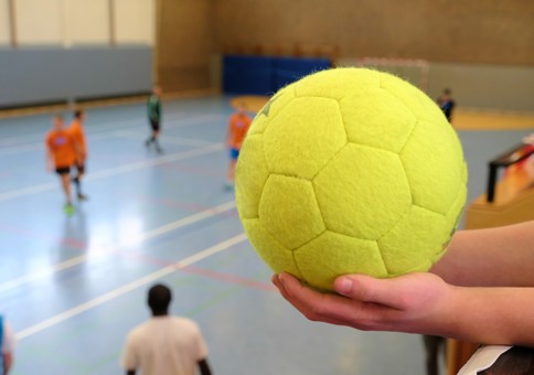 Dodgeball in a persons hand