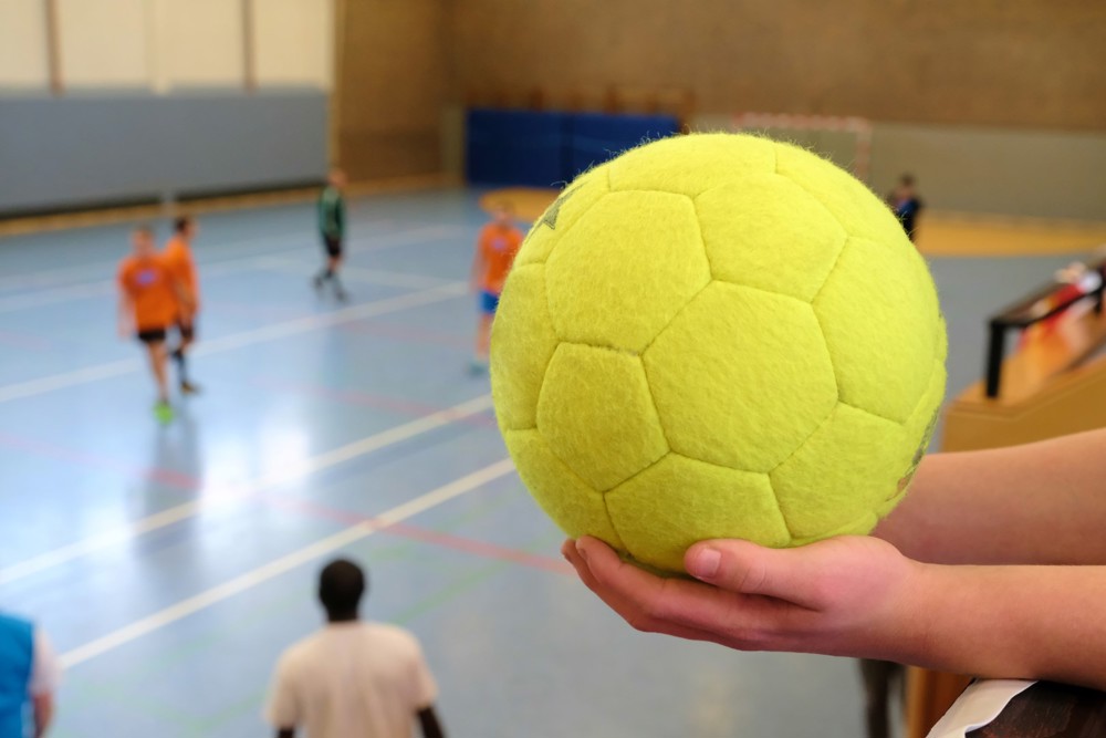 Dodgeball in a persons hand