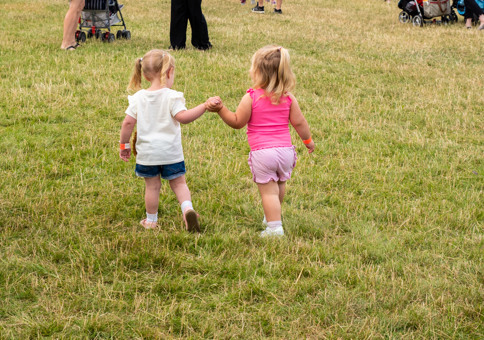 Two small girls holding hands
