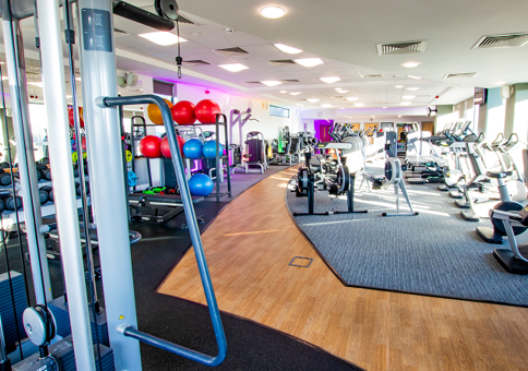 Well-equipped gym with cardio and weight machines and other equipment