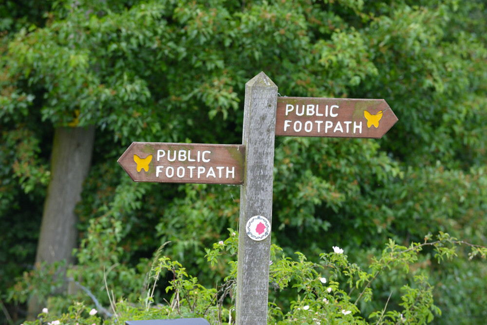 Wooden public footpath sign