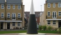 Large black cone with steel tip in a square in a residential area preview