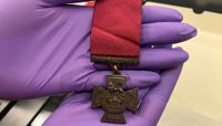 A close up of the front of a Victoria Cross medal.  preview