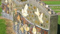 Stone wall with mosaic of local wildlife preview