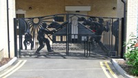 Wrought iron gates featuring cricketing figures preview