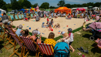 Families playing in large outdoor sandpit preview