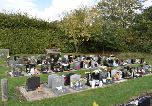 Graveyard with small headstones for cremated remains