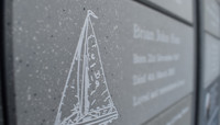 Small plaque with sailing ship etched into it preview