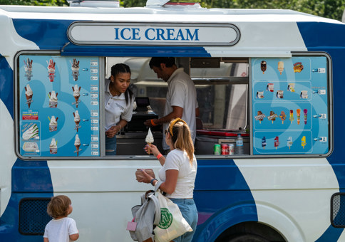 Woman buying ice cream from a van