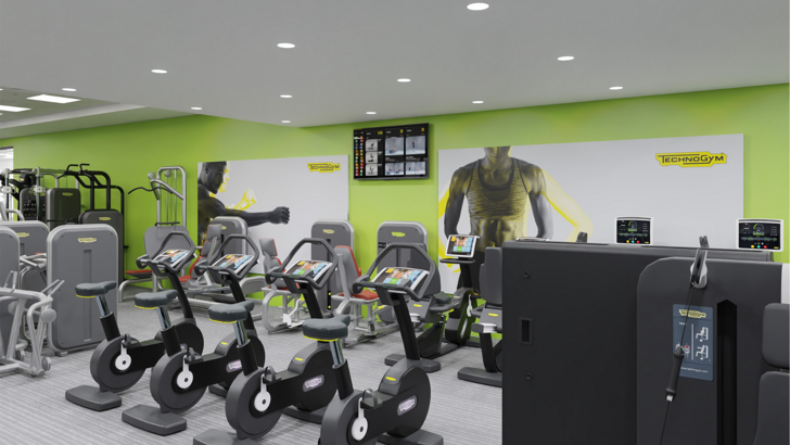 A digitally rendered image of how the CSAC gym should look once refurbished, showing two rows of various cycle machines against a light green wall and in the centre of the room, alongside various weights machines. The ceiling is dotted with downlights.