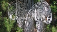 Steel sculpture in a woodland setting preview