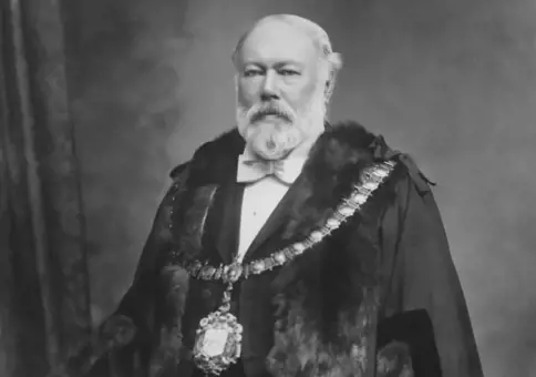 Man with robes and regalia of Mayoralty