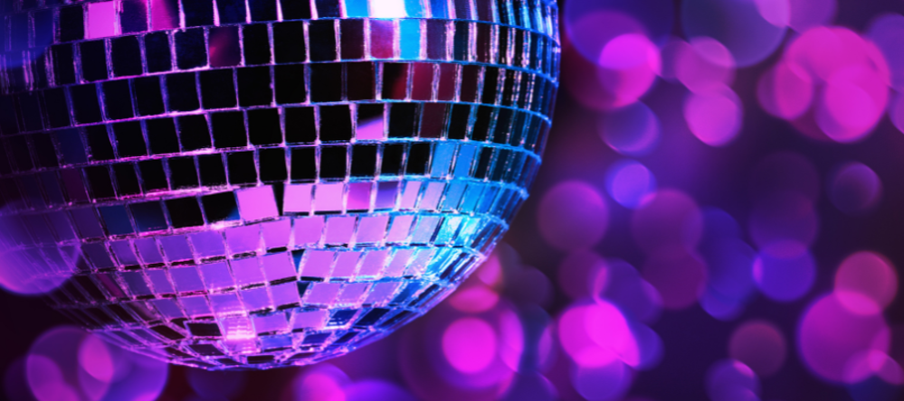 Disco ball with purple bokeh background