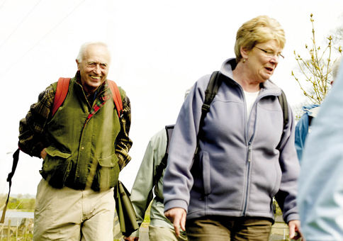 Smiling older people on a walk