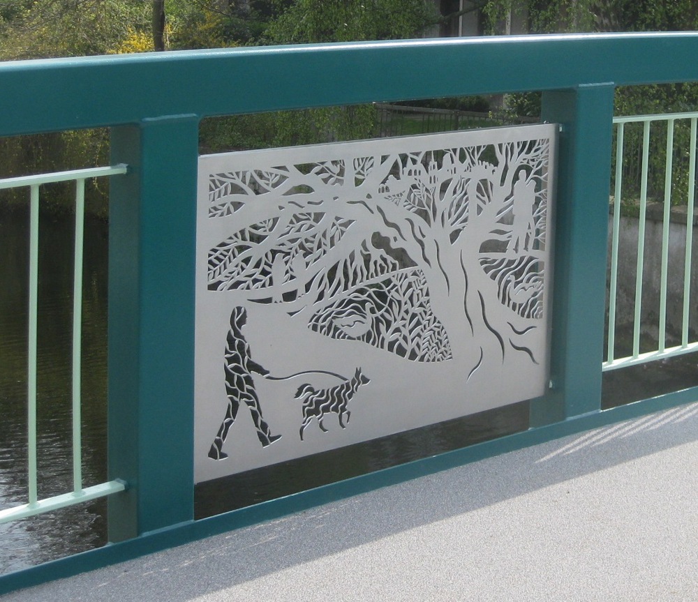 Intricate panel in bridge depicting tree and dog walker
