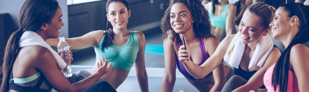 Group of women cooling down in exercise studio