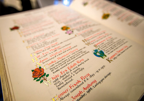 Page from Book of Remembrance, featuring hand written memorials