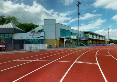 Red athletics track overlooked by the centre