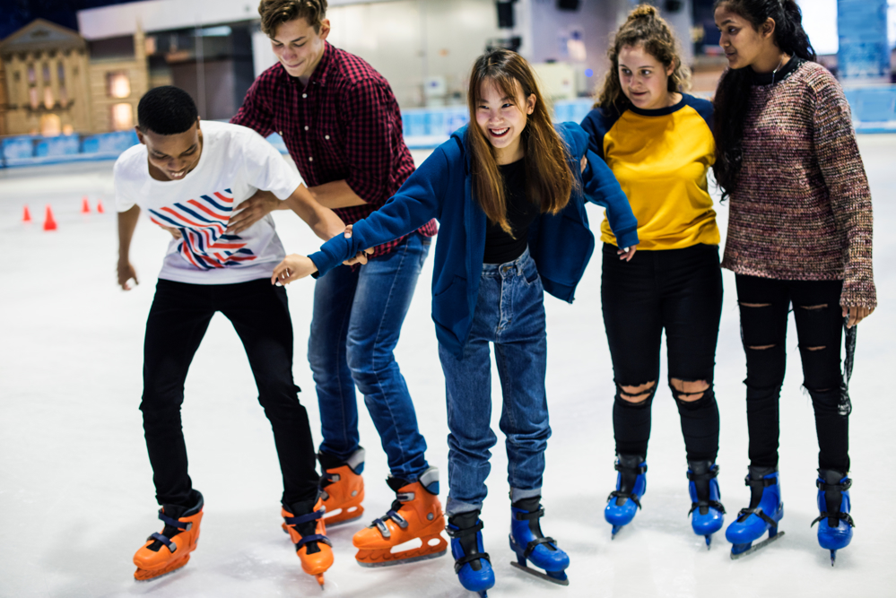 Group of young people ice skating