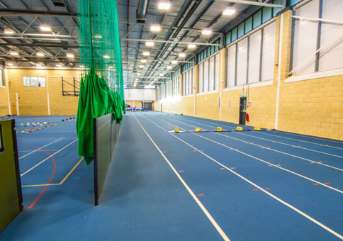 Indoor athletics track with blue flooring