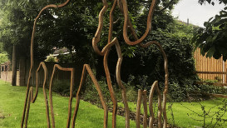 Metal sculpture of outline of horses