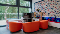 Kitchen play area with orange seating preview