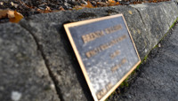 Small plaque fixed to kerbstone preview