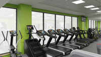A digitally rendered image of how the CSAC gym should look once refurbished, showing a row of cross trainers, step machines and treadmills against a light green wall with full length windows.. preview