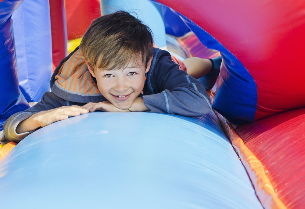 Boy playing on giant inflatable