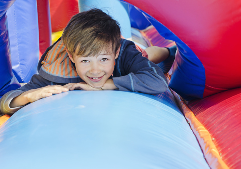 Boy playing on giant inflatable